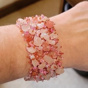 7" x 1 1/4" pink & red beaded bracelet.  Large stones & small beads. Magnetic